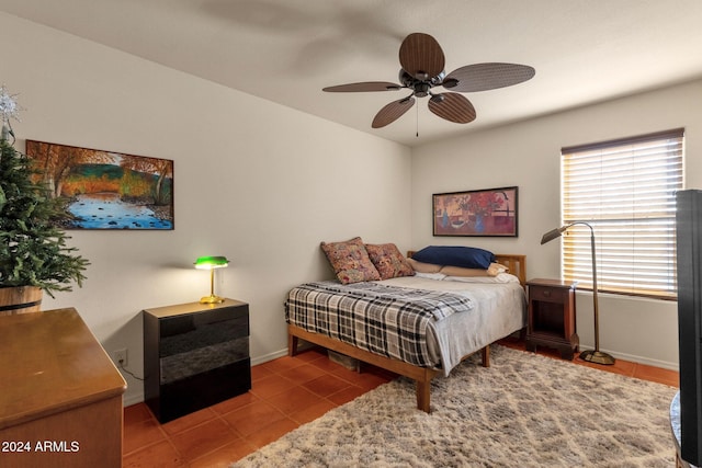 bedroom with tile patterned flooring and ceiling fan