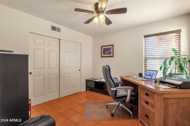 home office with ceiling fan and light tile patterned floors