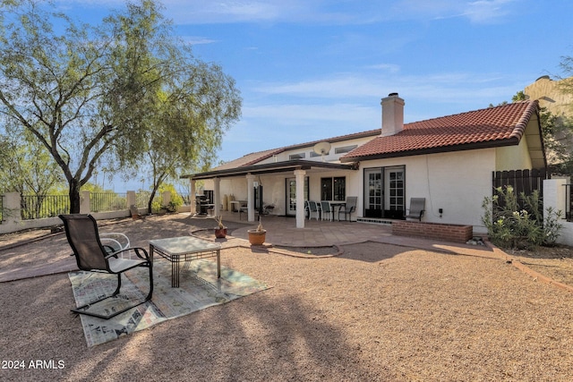 rear view of house with a patio