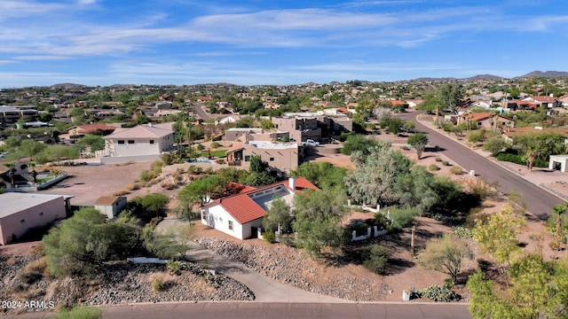 birds eye view of property with a mountain view