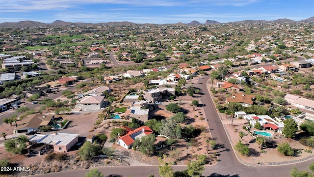 birds eye view of property with a mountain view