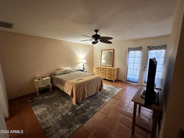 tiled bedroom featuring ceiling fan and access to exterior