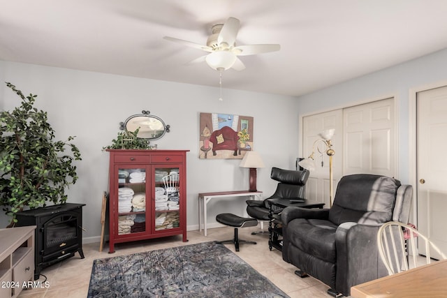 sitting room featuring ceiling fan and light tile patterned floors