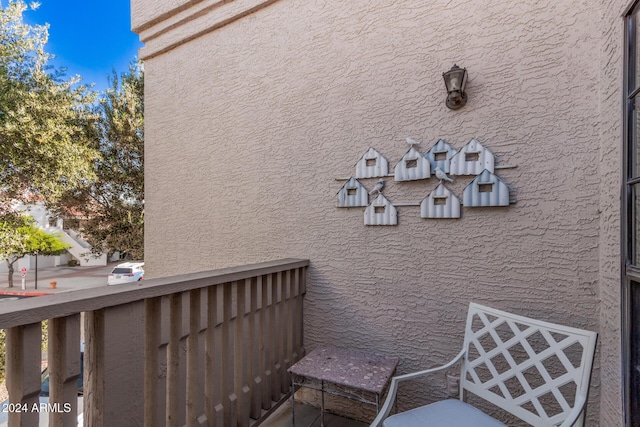 view of side of property featuring a balcony