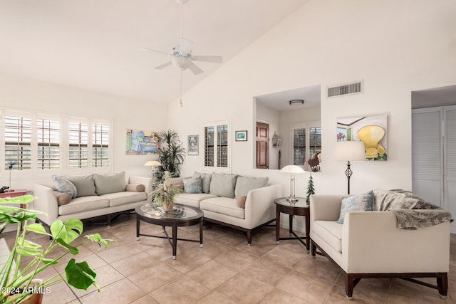 tiled living room featuring high vaulted ceiling and ceiling fan