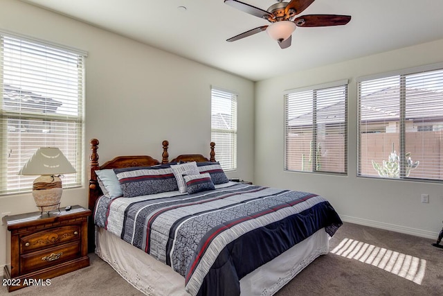 bedroom featuring ceiling fan and light colored carpet