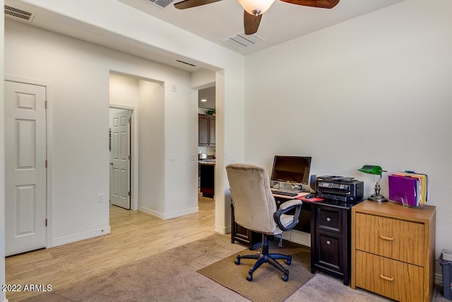 office area featuring light hardwood / wood-style floors and ceiling fan