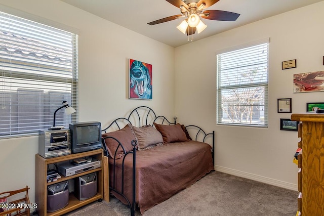 bedroom with light colored carpet and ceiling fan