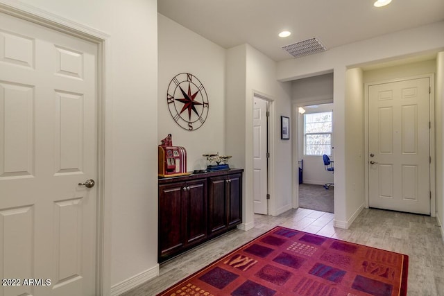 corridor featuring light hardwood / wood-style floors