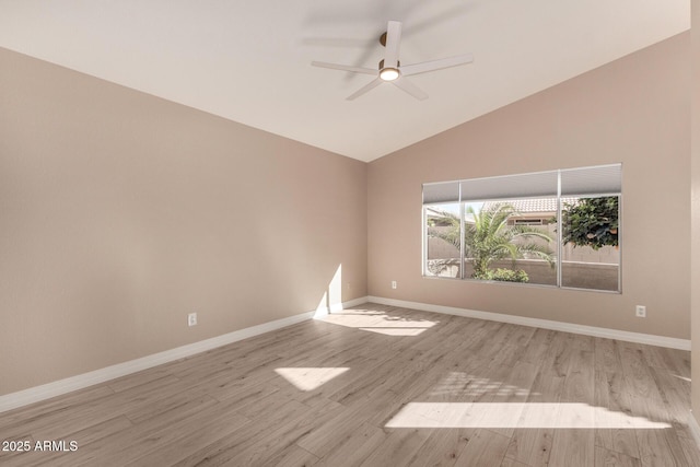 spare room featuring light wood-type flooring, ceiling fan, and lofted ceiling