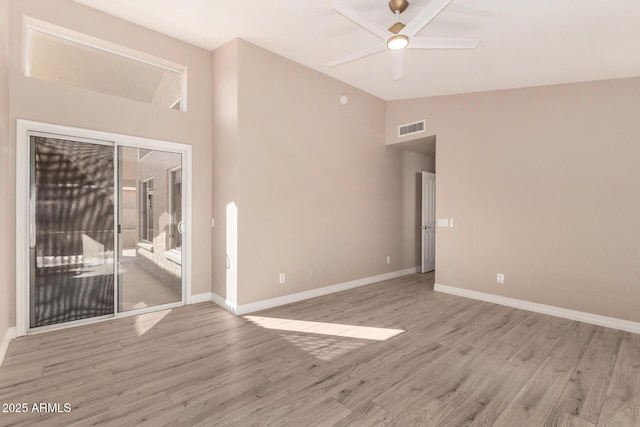 unfurnished room featuring light wood-type flooring, ceiling fan, and lofted ceiling