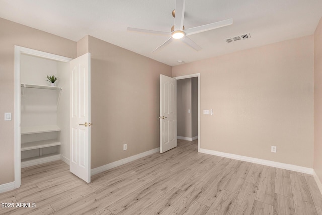 unfurnished bedroom featuring light wood-type flooring, visible vents, and baseboards