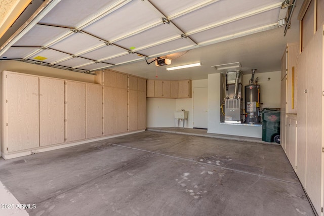 garage with heating unit, sink, a garage door opener, and gas water heater