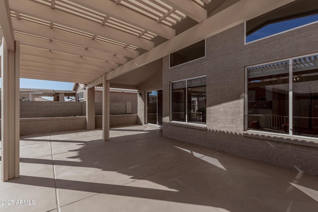 view of patio / terrace featuring fence and a pergola