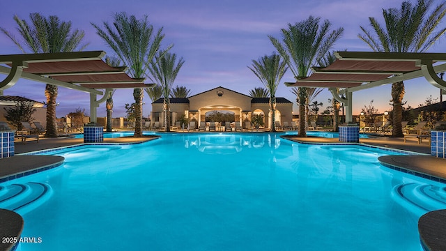 community pool featuring a pergola