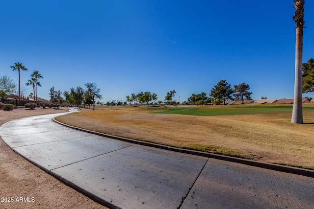 view of property's community featuring a lawn