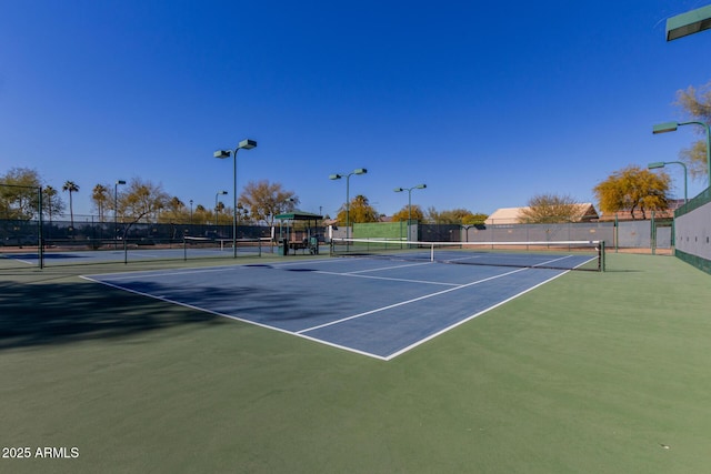 view of sport court with fence