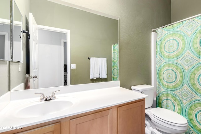 full bath with toilet, vanity, a shower with curtain, and a textured wall