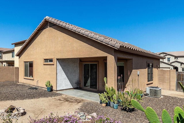 back of property featuring a patio area, stucco siding, and fence