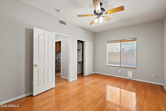 2024 N 125th Ave, Avondale, AZ 85392 - unfurnished bedroom with light wood-style floors, a closet, and ceiling fan