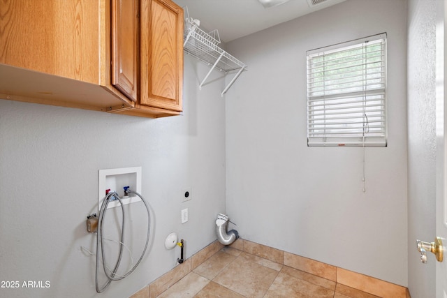 2024 N 125th Ave, Avondale, AZ 85392 - laundry area with hookup for a washing machine, cabinet space, gas dryer hookup, light tile patterned floors, and electric dryer hookup