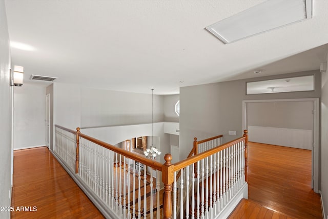2024 N 125th Ave, Avondale, AZ 85392 - hall with hardwood / wood-style flooring and an upstairs landing