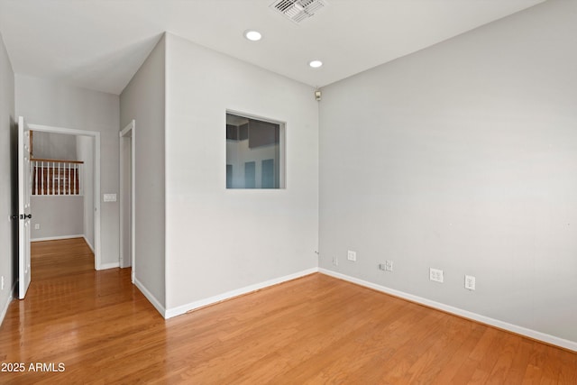 2024 N 125th Ave, Avondale, AZ 85392 - spare room featuring light wood-style flooring and recessed lighting