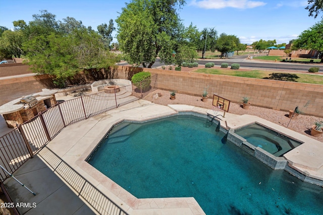 2024 N 125th Ave, Avondale, AZ 85392 - view of pool with a pool with connected hot tub, a fenced backyard, and a patio area