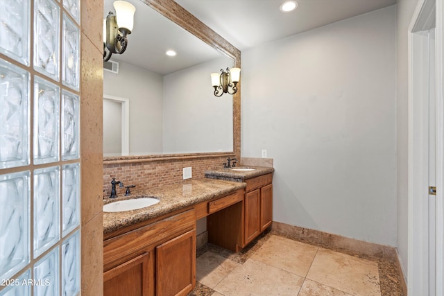 2024 N 125th Ave, Avondale, AZ 85392 - full bath with double vanity, decorative backsplash, recessed lighting, and stone finish floors