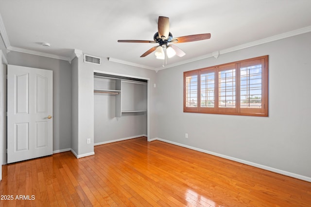 2024 N 125th Ave, Avondale, AZ 85392 - unfurnished bedroom with a closet, light wood-style flooring, crown molding, and a ceiling fan