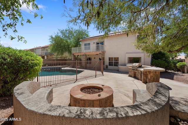 2024 N 125th Ave, Avondale, AZ 85392 - view of pool featuring area for grilling, a patio area, and an outdoor fire pit