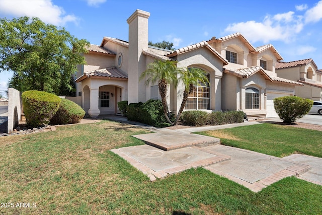 2024 N 125th Ave, Avondale, AZ 85392 - mediterranean / spanish house with stucco siding, a chimney, a front yard, and a tile roof