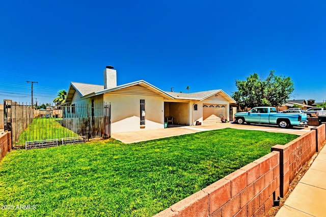 505 S S Rdg, Mesa, AZ 85204 - rear view of property featuring driveway, stucco siding, an attached garage, and a chimney