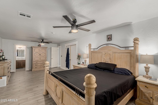 505 S S Rdg, Mesa, AZ 85204 - bedroom featuring light wood-type flooring, a ceiling fan, ensuite bath, and a closet