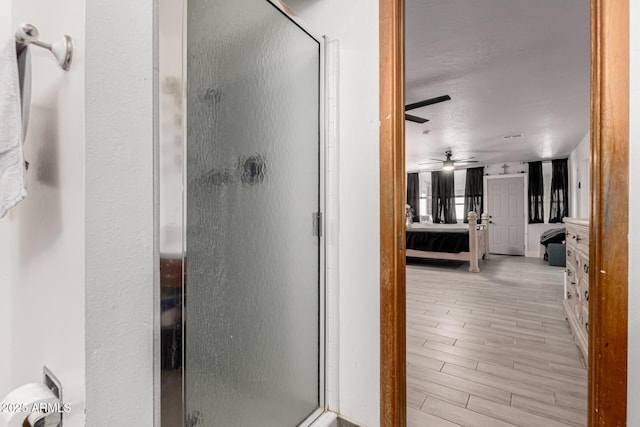 505 S S Rdg, Mesa, AZ 85204 - ensuite bathroom featuring a shower stall, ceiling fan, and wood finished floors