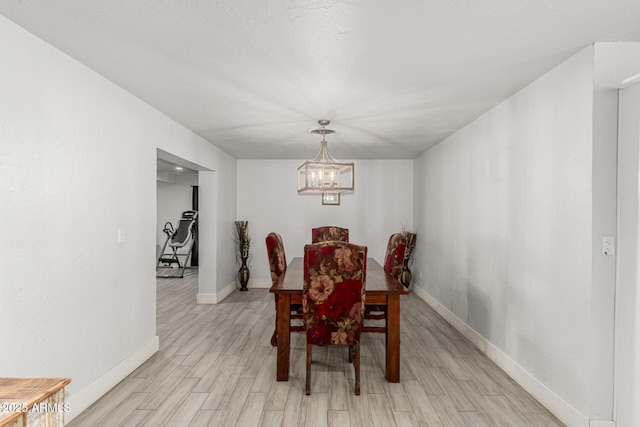 505 S S Rdg, Mesa, AZ 85204 - dining room with light wood-style floors and a chandelier