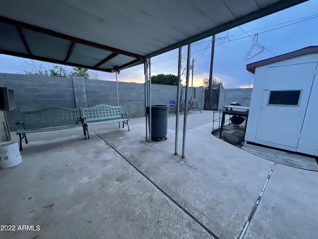 view of patio terrace at dusk