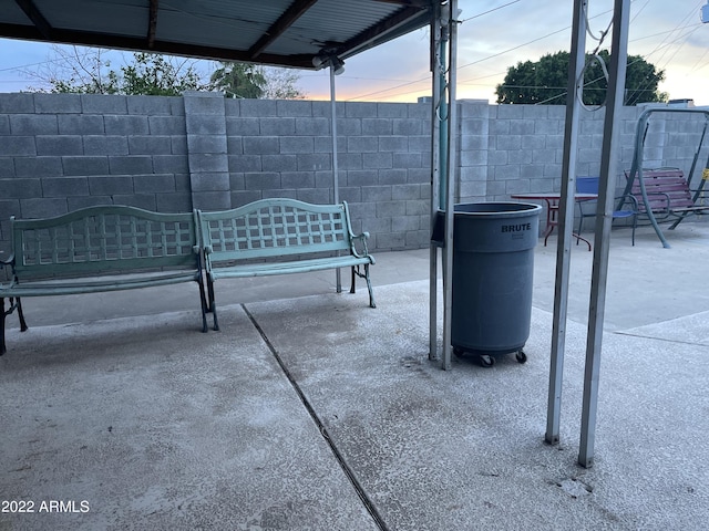 view of patio terrace at dusk