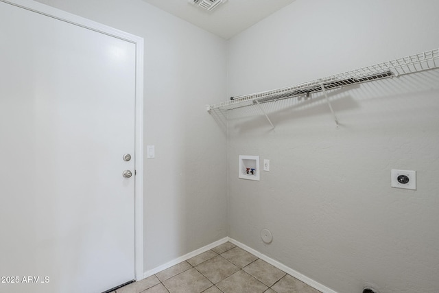 16077 W Larkspur Dr, Goodyear, AZ 85338 - washroom with hookup for a washing machine, electric dryer hookup, baseboards, light tile patterned floors, and gas dryer hookup