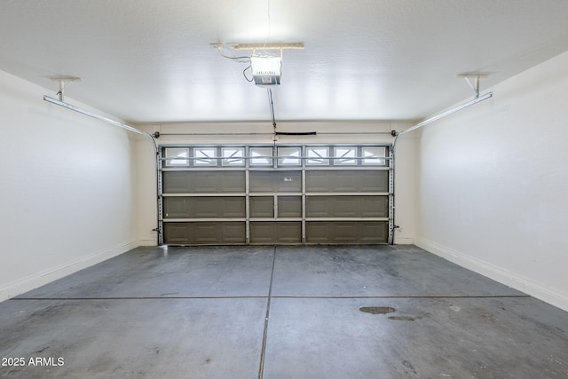 16077 W Larkspur Dr, Goodyear, AZ 85338 - garage with a garage door opener and baseboards