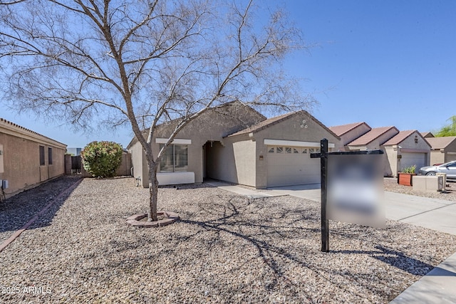 16077 W Larkspur Dr, Goodyear, AZ 85338 - ranch-style home featuring an attached garage, stucco siding, fence, and concrete driveway