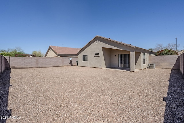 16077 W Larkspur Dr, Goodyear, AZ 85338 - rear view of property with cooling unit, stucco siding, and a fenced backyard