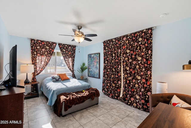 bedroom featuring ceiling fan and light tile patterned floors