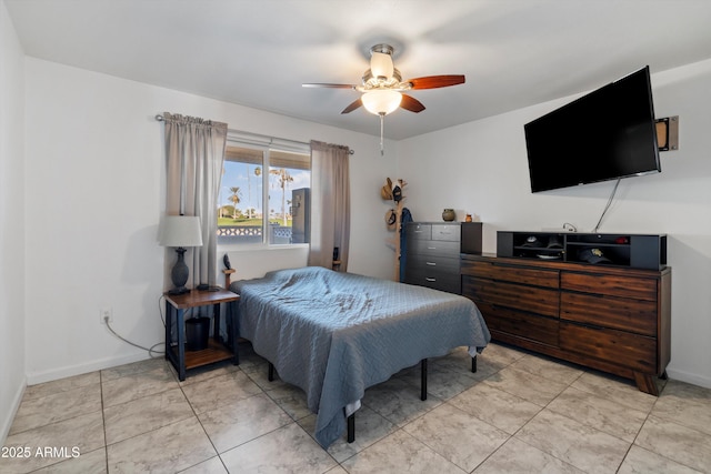 bedroom featuring ceiling fan and light tile patterned flooring