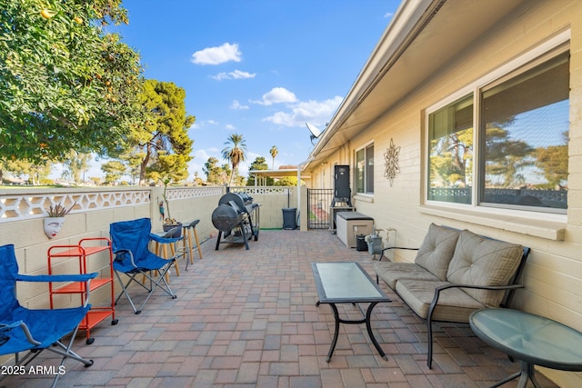 view of patio / terrace with area for grilling and an outdoor hangout area