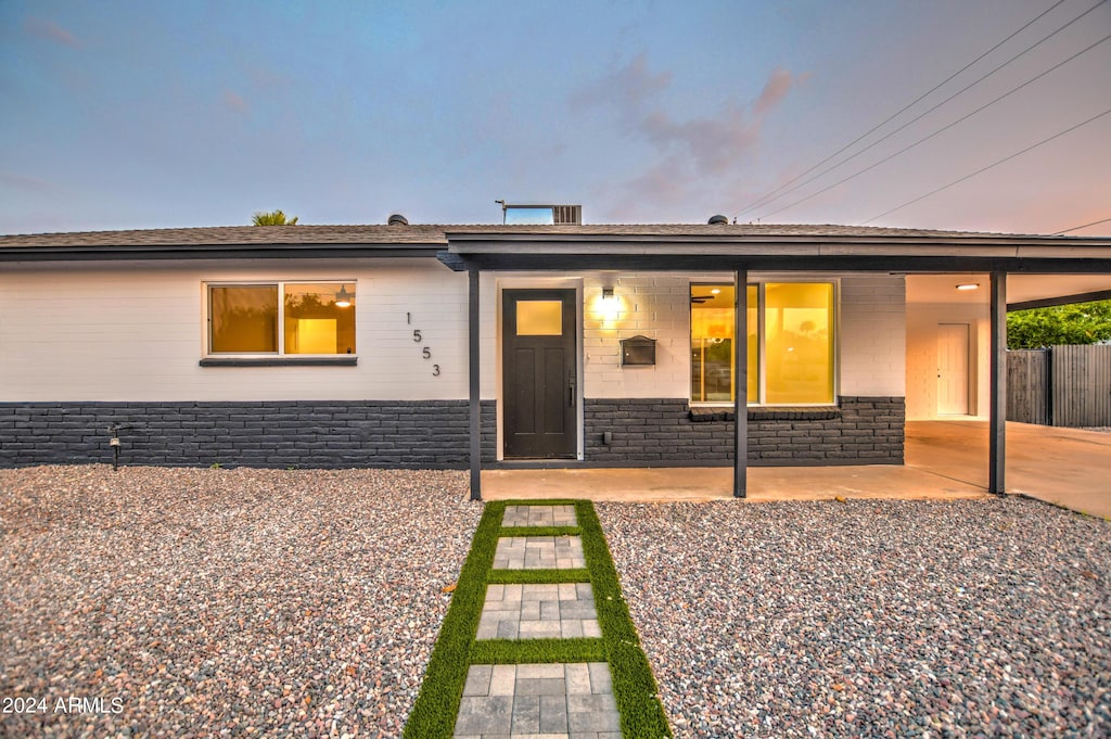 single story home featuring a patio area