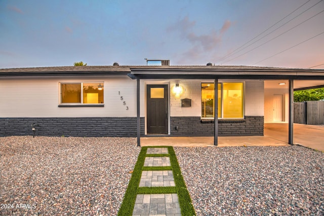 single story home featuring a patio area