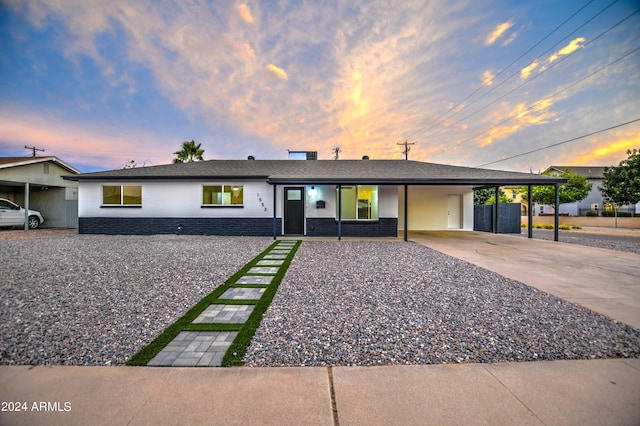 ranch-style home with a carport