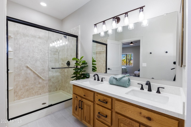 bathroom with tile patterned flooring, vanity, ceiling fan, and a shower with shower door