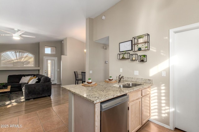 kitchen featuring light brown cabinetry, ceiling fan, sink, dishwasher, and light tile patterned flooring